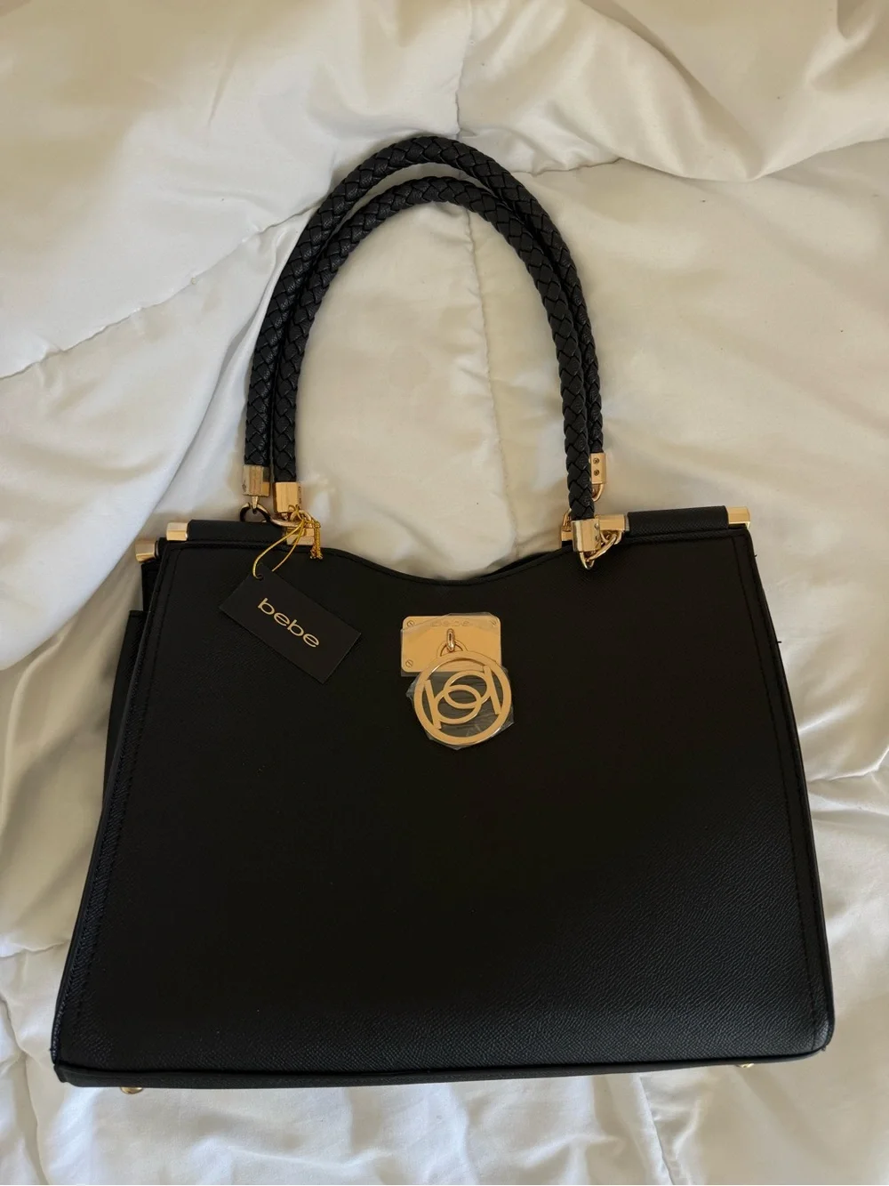 bebe Black Satchel with Braided Top Handles and Gold Emblem